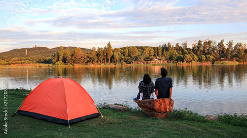 People seat with tent near East Lake of Hubei province. East Lake Scenic Area of Wuhan