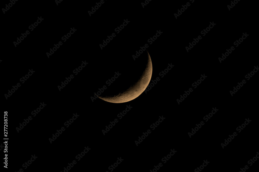 C-shaped section or Crescent of the moon surface that can be seen after sunset with a telescope. (Astronomy, Atmosphere, Science) C-shaped section or Crescent of the moon surface that can be seen after sunset with a telescope. (Astronomy, Atmosphere, Science)