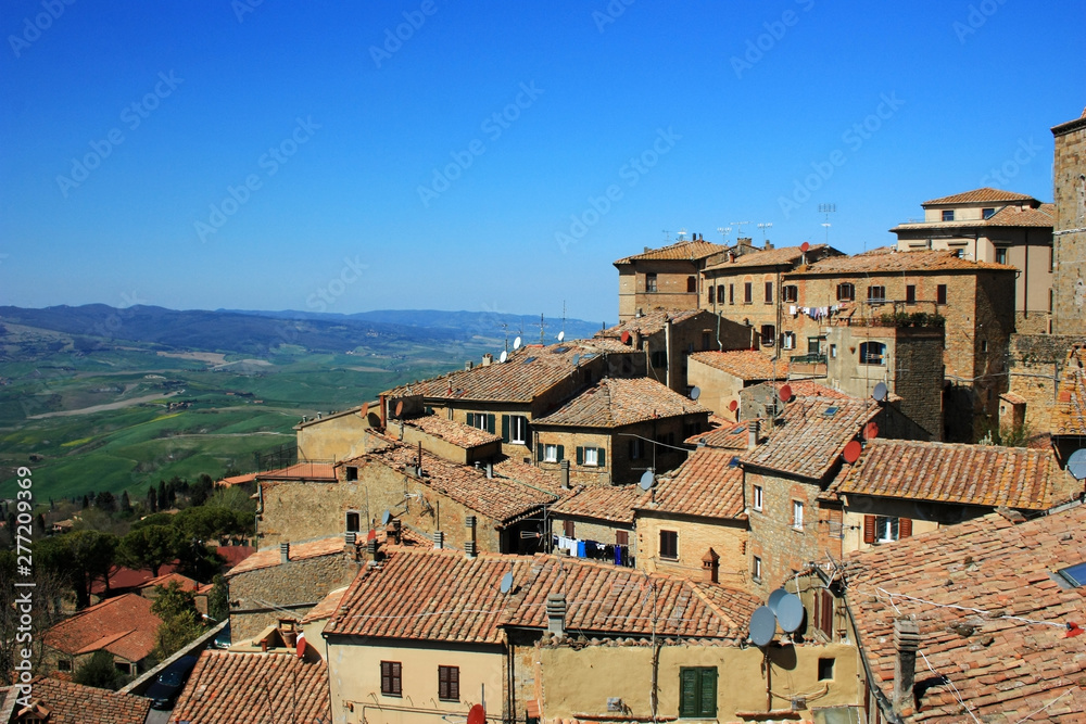 Medieval stone buildings in the city of Volterra, Italy
