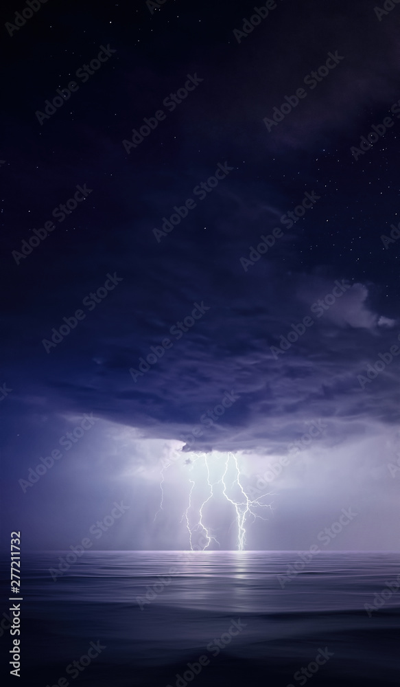 Starry night with Thunderstorm. Night thunderstorm with lightning above the sea