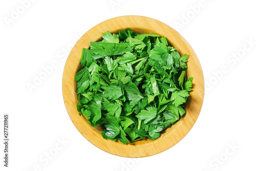Fresh parsley  a wooden bowl isolated on a white background. Top view
