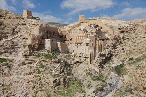 Holy Lavra of Saint Sabbas the Sanctified, known in Arabic as Mar Saba monastery perched on the rocks in the Judean desert in Israel. West Bank, Palestine, Israel. Remote monastery photo