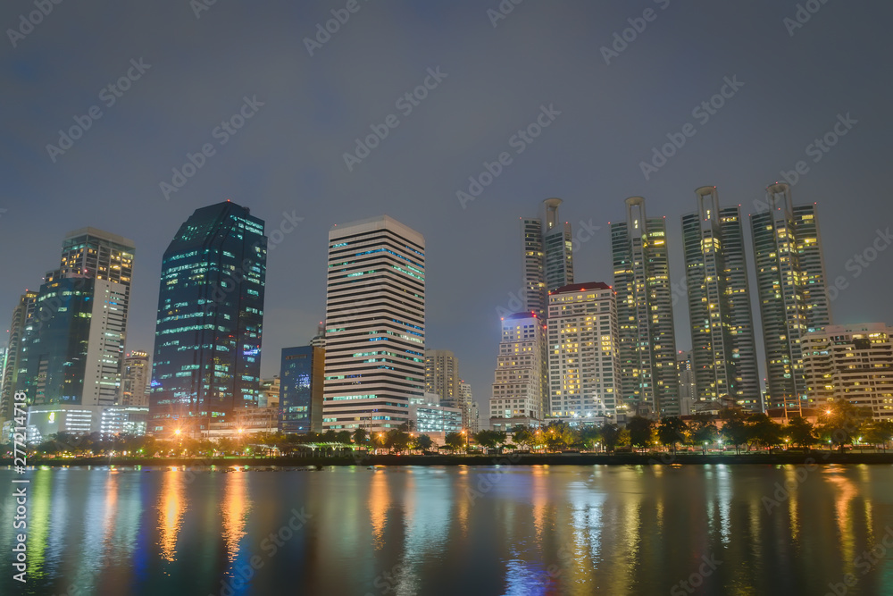 Night city at the park with commercial building.