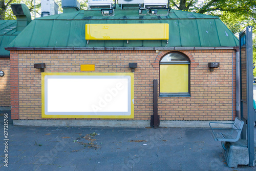 Store front with blank signs, brick wall