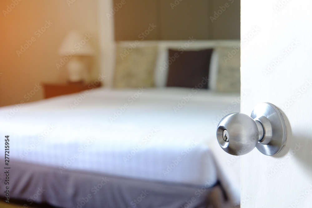 Door with metal round knob opening to a clean bedroom Door with metal round knob opening to a clean bedroom