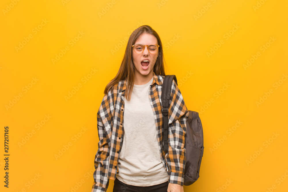 Young student woman screaming very angry and aggressive Young student woman screaming very angry and aggressive