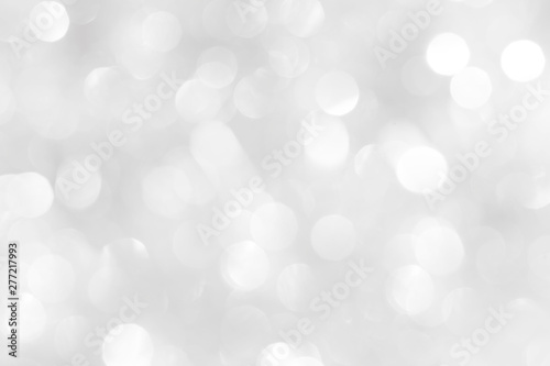 A brilliant white background with circles and ovals. Template for a holiday card with bright and sparkling lights.