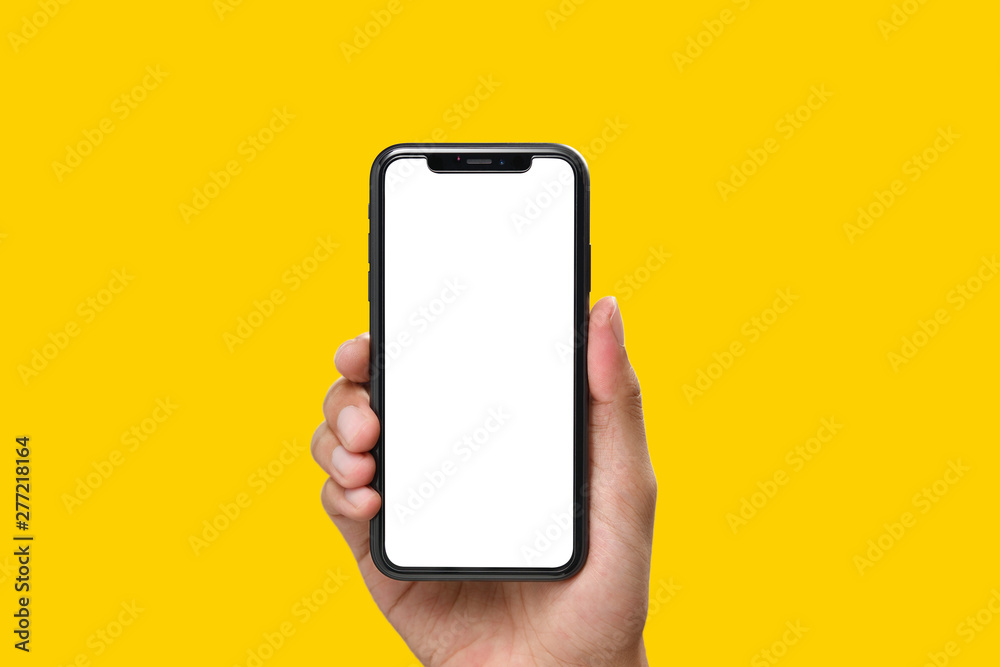 Hand holding the black smartphone with blank screen and modern frame less  design on yellow colour background Stock Photo | Adobe Stock