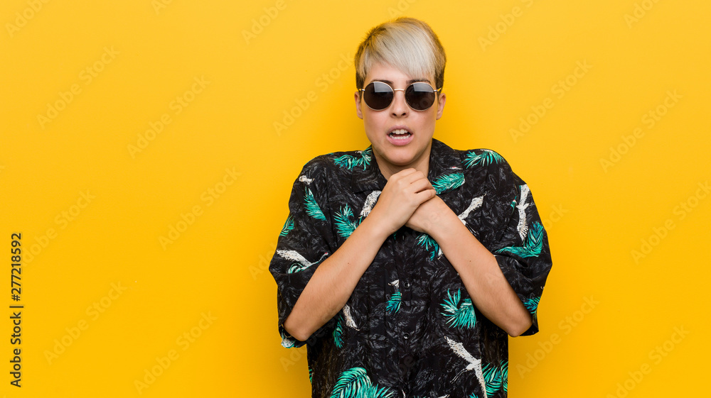 Fototapeta premium Young curvy woman wearing a summer look scared and afraid.