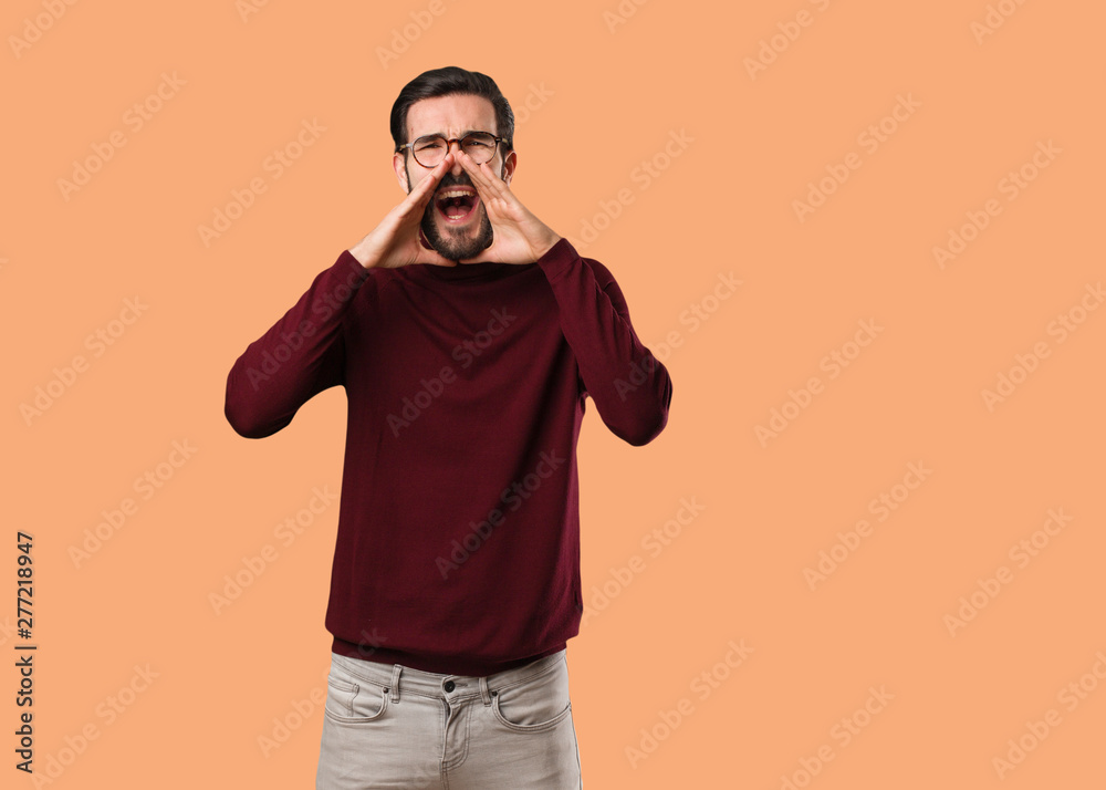 Young natural man shouting something happy to the front