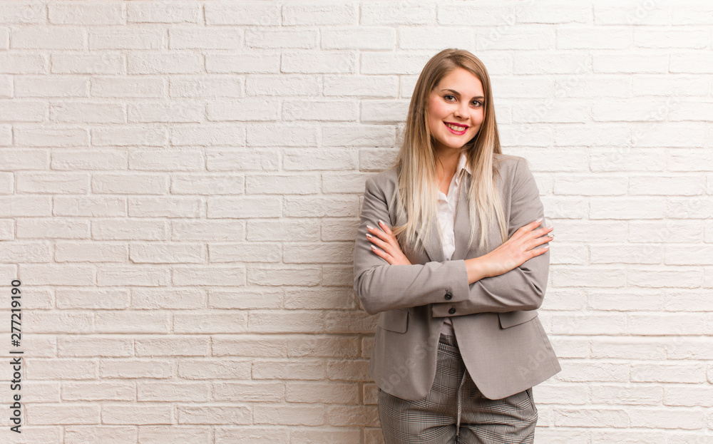 Young russian business woman crossing arms, smiling and relaxed Young russian business woman crossing arms, smiling and relaxed