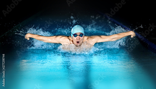 Man in swimming pool. Butterfly style © Andrey Burmakin