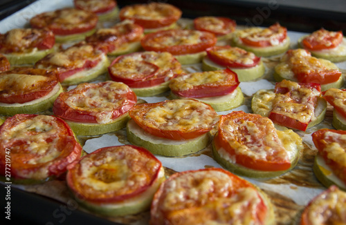 Baked zucchini with tomatoes, cheese, parsley and sauce