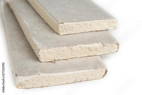 Fotografi Stacking of white gypsum panels, drywall or plasterboard