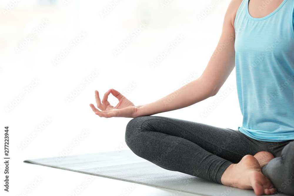 Beautiful woman meditating indoors, space for text. Zen yoga