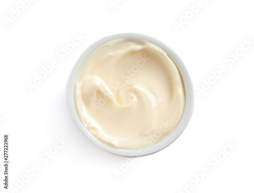 Delicious mayonnaise sauce in bowl on white background, top view