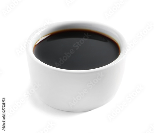 Traditional soy sauce in bowl on white background