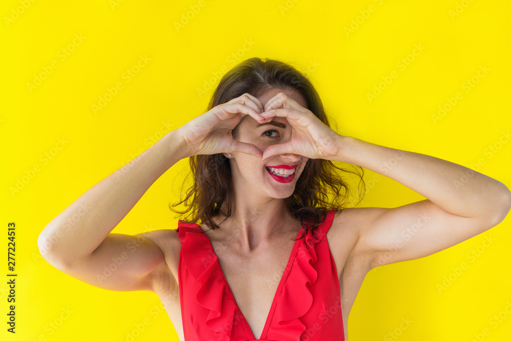 Fototapeta premium Heart hand gesture. Fingers folded into heart symbol