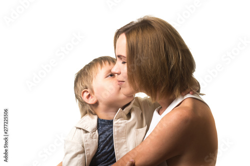 Happy mom and little son are hugging isolated on white background. Mother and child relationship.