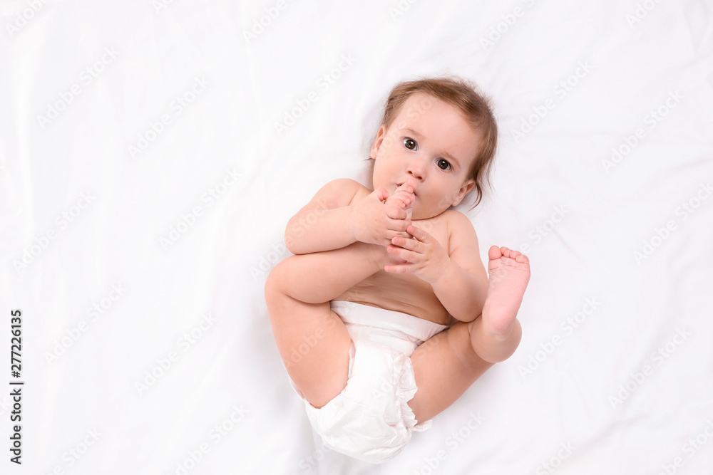 Cute little baby lying on white background, top view Cute little baby lying on white background, top view