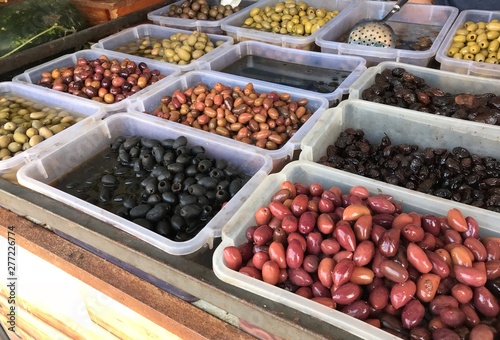 Variety of fresh olives for sale at farmers market 