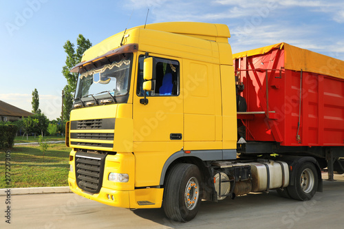 Modern bright truck parked on country road