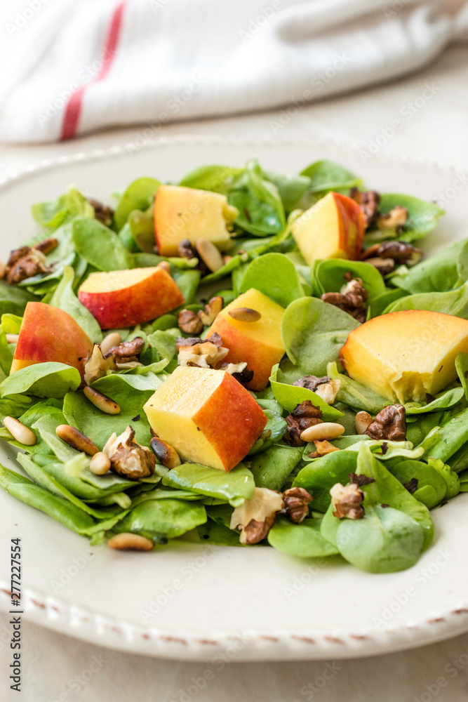 Purslane Salad with Peach Fruit, Roasted Walnuts and Pine Nuts.