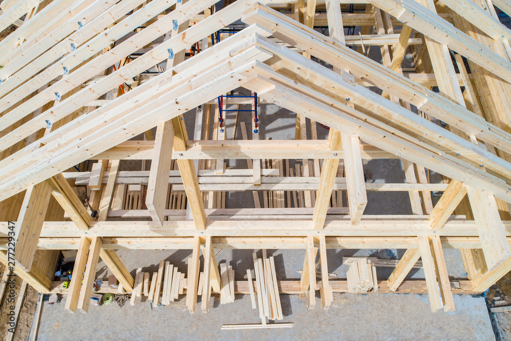 The wooden skeleton of the house top view. Construction site. Wooden frame  of the home from