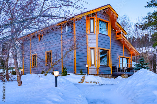 Winter two-storey cottage i...