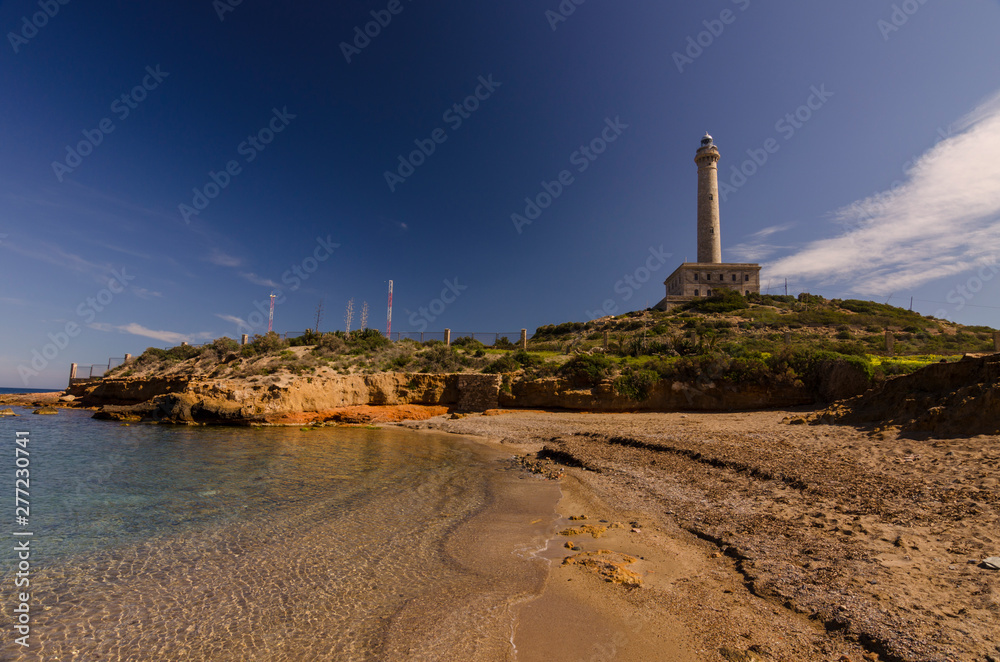 Fototapeta premium Faro de Cabo de Palos, located on a small peninsula in Cartagena (Murcia) Spain
