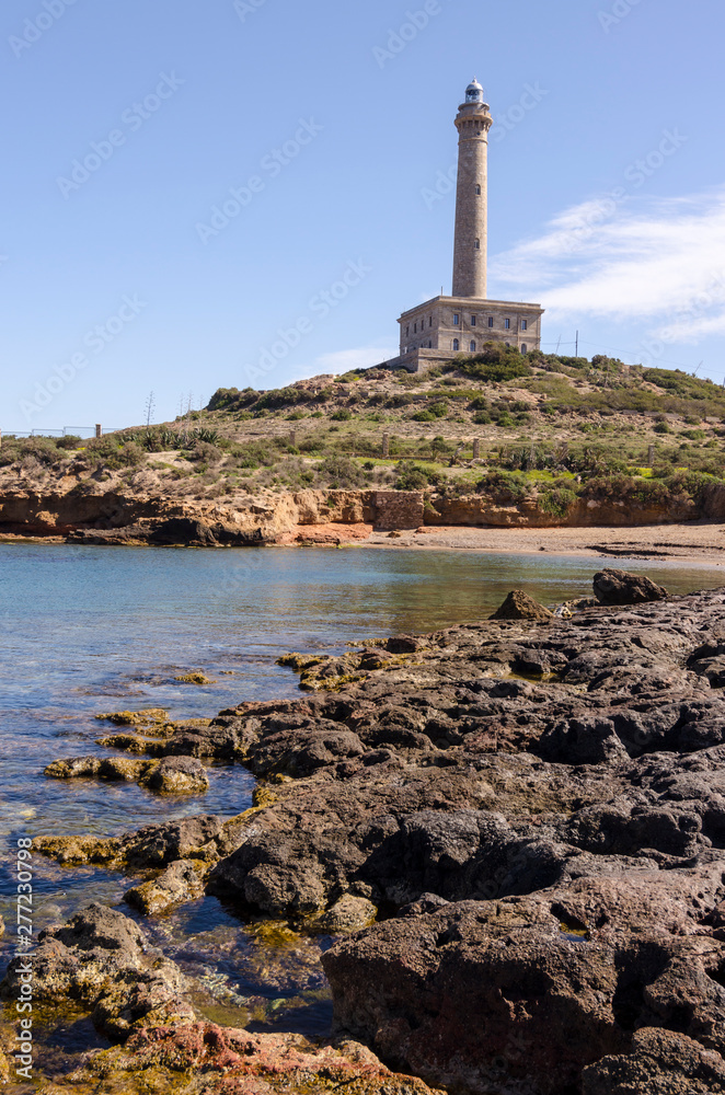 Fototapeta premium Faro de Cabo de Palos, located on a small peninsula in Cartagena (Murcia) Spain