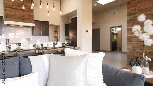 Kitchen Reveal from In Front Of Couch Tilt Down. view rises and reveals wide shot of kitchen from in front of couch in open concept living