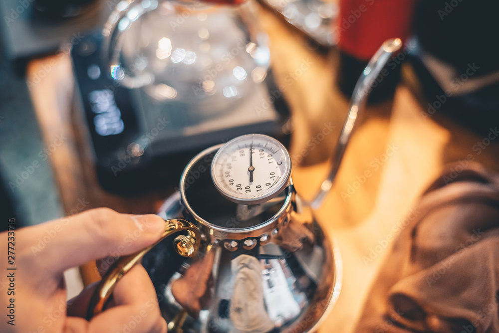 Obraz premium Barista making drip coffee in coffee shop, barista cafe making coffee, coffee maker