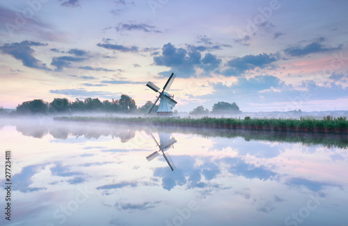 charming Dutch windmill at dawn