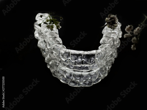 Invisalign braces or retainer isolated on black background