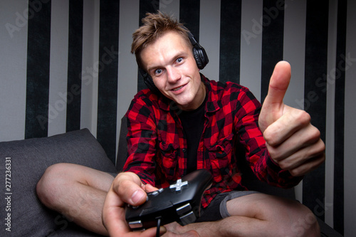 young guy plays video games...