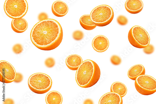 Falling orange slice isolated on white background, selective focus