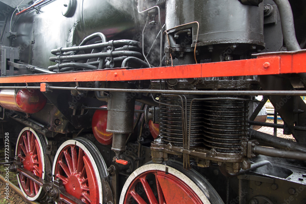 Fototapeta premium A fragment of an old steam locomotive