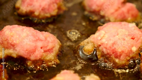 Frying Meatballs in the deep hot oil in the frying pan