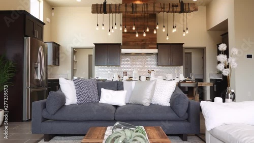 Living Room Walk Through to Kitchen Lower Angle. view moves through living room into kitchen open floor concept in modern home