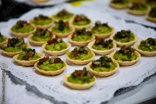 Guacamole bites on cups served from catering