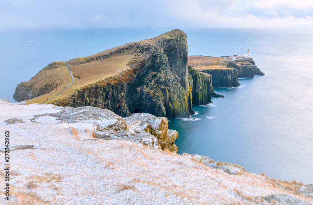 Isle of Skye winter landscape - Neist Point lighthouse and storm over ocean