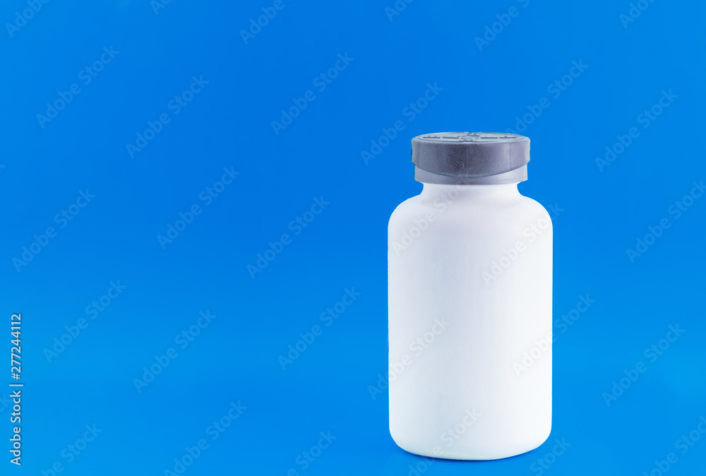 Empty pill bottle. Beautiful blue background Empty pill bottle. Beautiful blue background