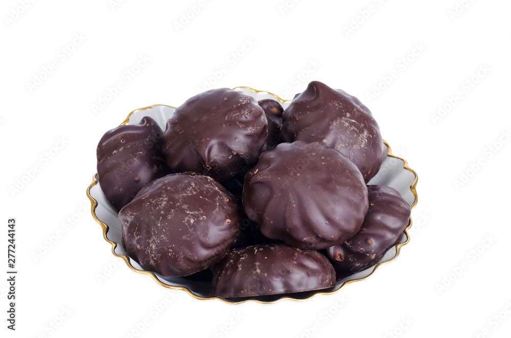 Delicious marshmallows in chocolate on plate. Image on white background. Delicious marshmallows in chocolate on plate. Image on white background.