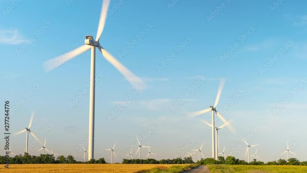 Time lapse wind turbines. Rapidly rotating blades of wind power plants. Great view of the environment and new alternative technologies for the production of electrical energy. Time lapse wind turbines. Rapidly rotating blades of wind power plants. Great view of the environment and new alternative technologies for the production of electrical energy.
