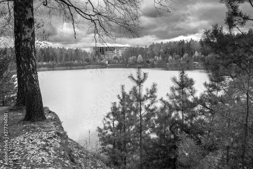 Beautiful forest lake old quarry rainy and gloomy autumn day