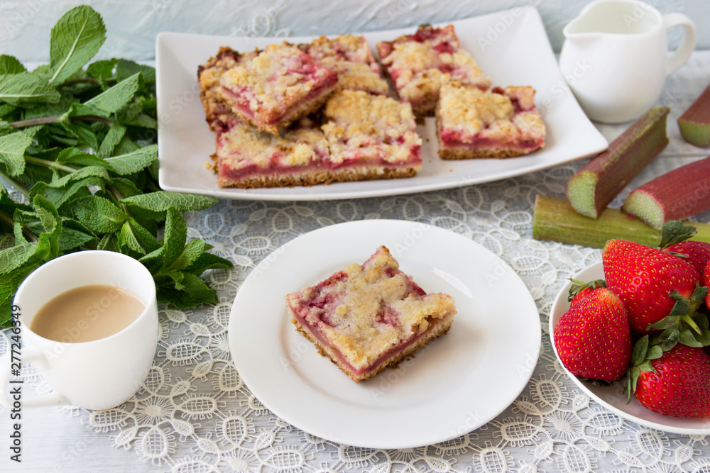 Homemade cake with fresh strawberries and rhubarb.
