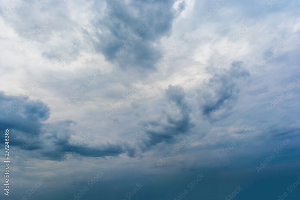 Obraz premium Dark storm clouds in the sky. Blurring background. Bright colors.