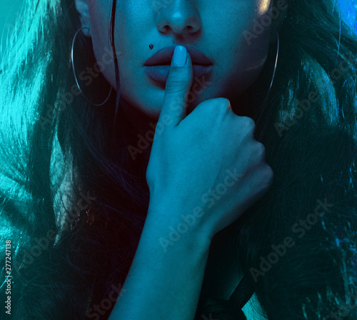 Sensual woman neon light half portrait. Beautiful young female model in neon light image photo