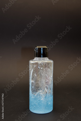 Wallpaper Mural A bottle of household chemicals cosmetics on a black background neck of a bottle close up macro pattern Torontodigital.ca